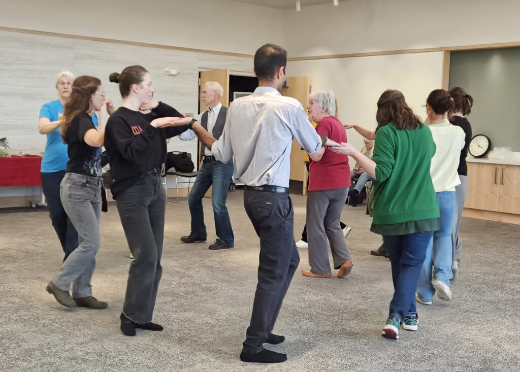 group of people doing a folk dance.